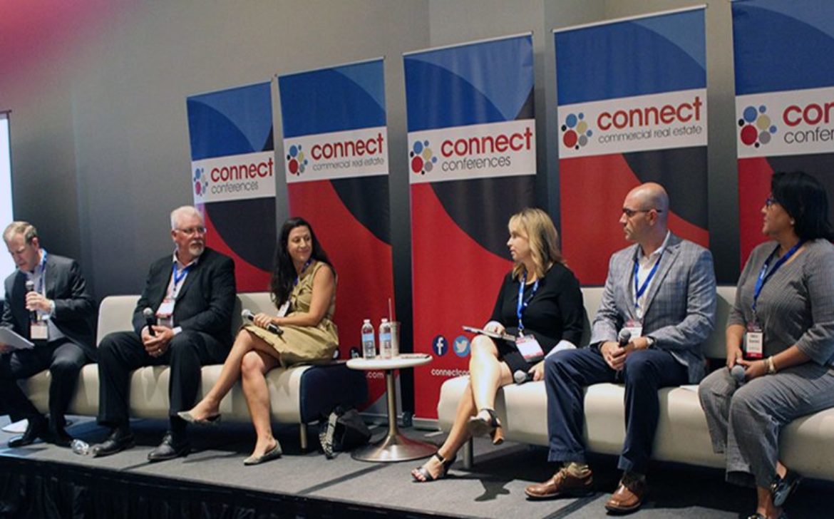Photo of participants at Connect Commercial Real Estate panel speakers