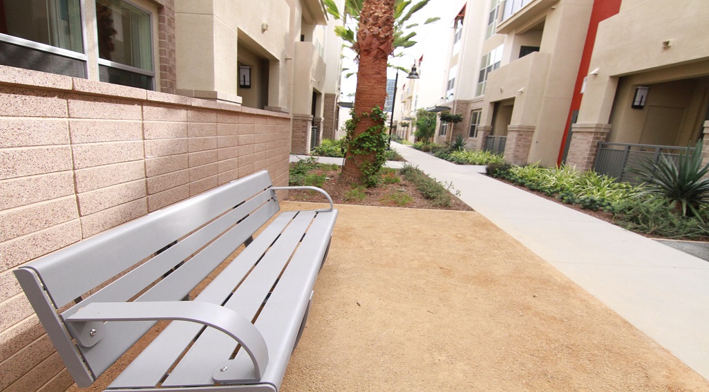 First Street apartments walkway and bench