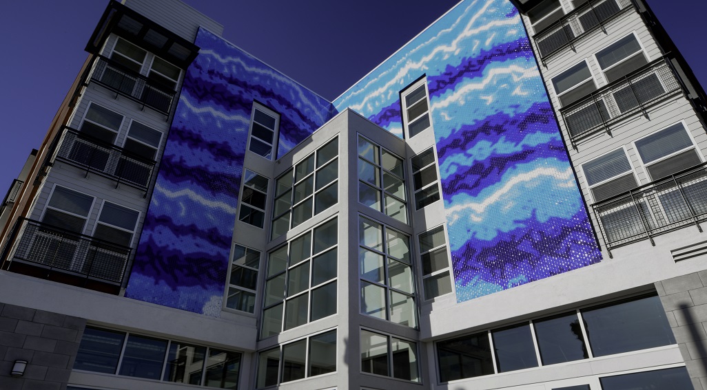 Las Ventanas apartments exterior mural in a wave pattern
