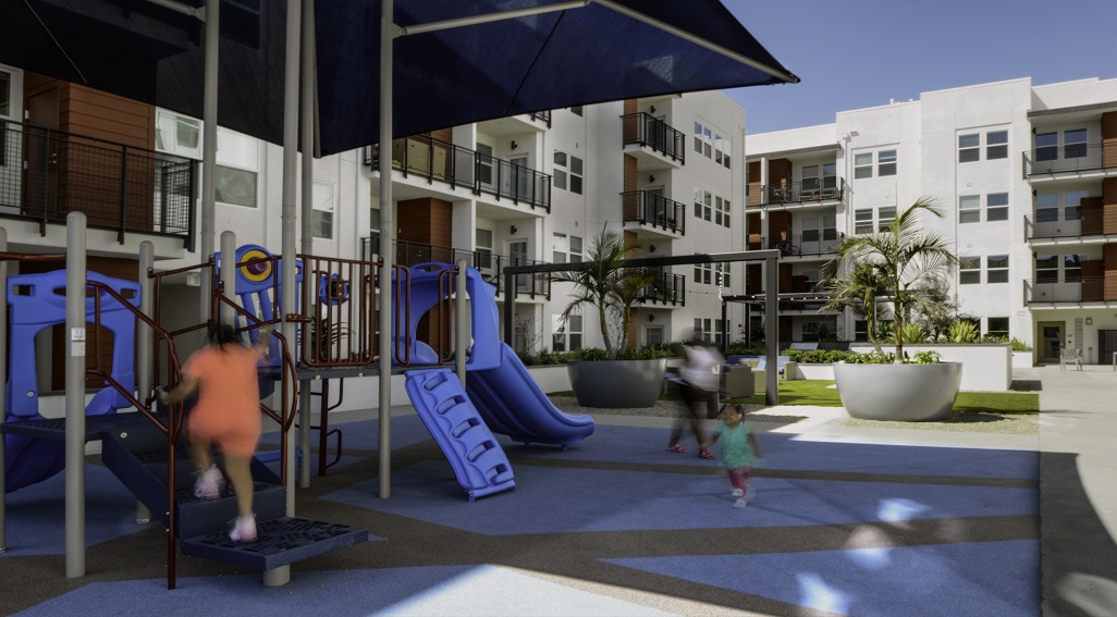 Las Ventanas apartments playground area with children playing