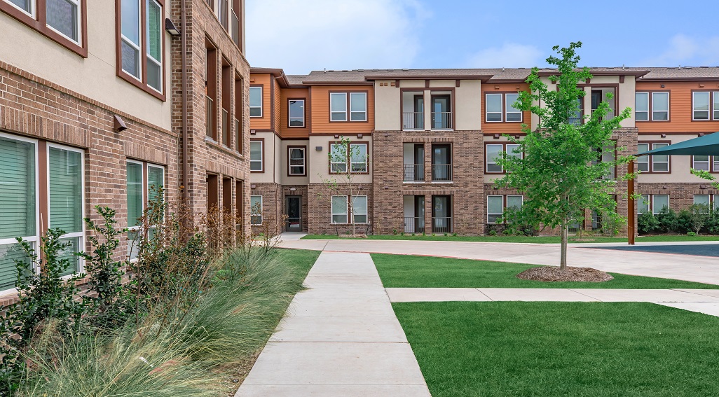 Photo of Richcrest Apartments walkway and buildings